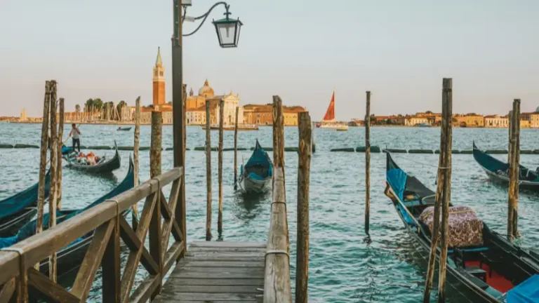 Gondolas moored in Venice's canals, offering a romantic setting for couples.