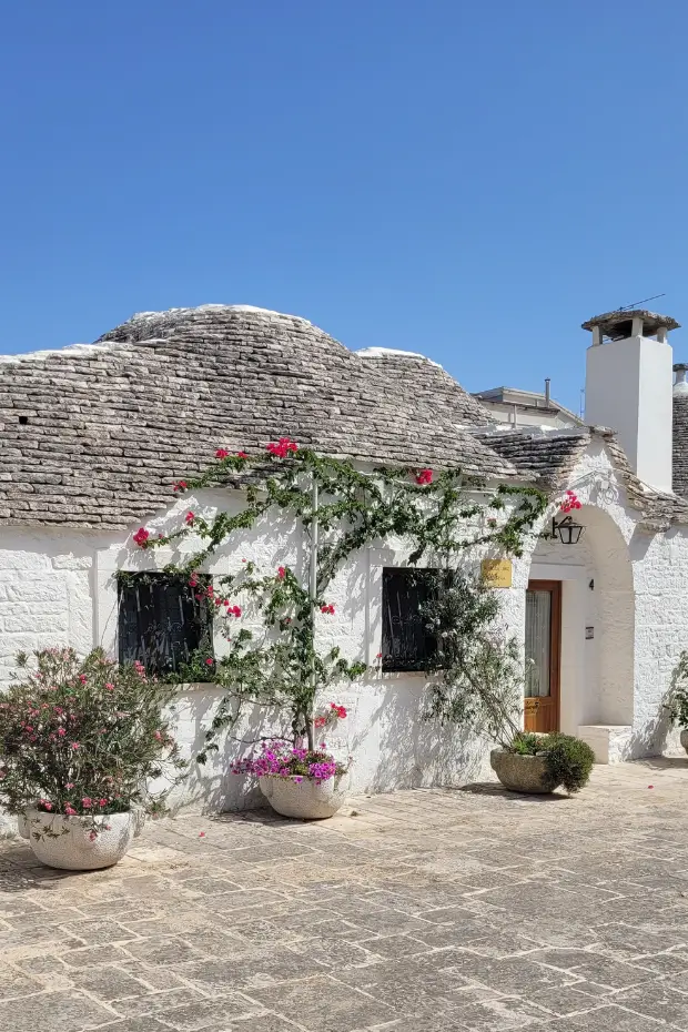 A white washed trulli in Puglia, where honeymooners find storybook romance.
